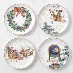 four plates with christmas decorations on them