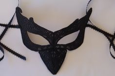 This is the lastest collection to my shop from all the different designs that I have, in large variety in colors and shapes. This mask is perfect for Halloween costumes, comicon and all the fun occasions. This mask like all my all my masks in the shop is very comfortable to wear for the long hours of the occasions. I made this solid black but if you wish this mask in a different color I can definitely change it, that's no problem I'm available anytime so please contact me. I also have one that h Handmade Masquerade Mask For Halloween Cosplay, Handmade Halloween Festival Masquerade Mask, Handmade Fantasy Masquerade Mask For Costume Party, Handmade Black Masks And Prosthetics For Costume, Handmade Costume Accessories For Halloween Masquerade, Fitted Costume Mask And Prosthetics, Handmade Halloween Costume Mask, Handmade Black Masquerade Mask For Halloween, Handmade Black Masks For Costume Party