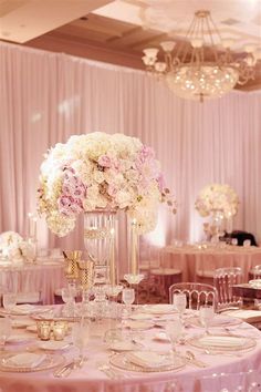 the tables are decorated with pink and white flowers