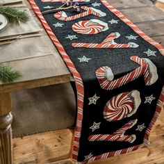 the table runner is decorated with candy canes