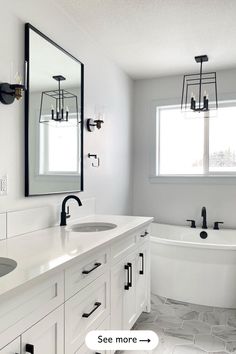 a white bathroom with two sinks and a bathtub