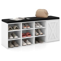 a white shoe rack with shoes on top and a handbag sitting on top of it