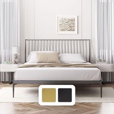 a bedroom with white walls and wood flooring next to a bed in front of two windows