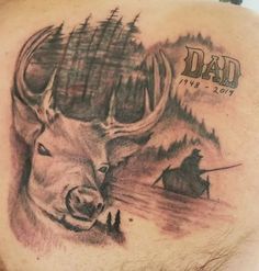 the back of a man's shoulder with a deer and trees on it