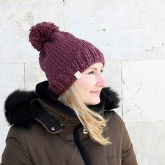 a woman wearing a winter hat and coat