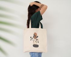 This 100% cotton bag comes in one size - 15" x 16" - perfect for everyday use. While the canvas material will showcase our designs in great color, it's durable and will last for years. The bag has 20" handles (made of the same canvas) that make it easy to carry even during a week's shopping. -100% cotton canvas -Heavy fabric  -Sewn-in label Care Instructions:  Machine wash cold; Non-chlorine: bleach as needed Tumble dry: Medium Heat; Do not iron directly over the printed area - print may stick to the iron. Shipping: Our goal is to swiftly handle all orders and have them shipped out within a span of 1-5 days. However, during periods of high demand or promotional events, we kindly request your understanding for potential processing delays of up to 7-10 business days. Our shipment originates Artsy Cotton Bags For Everyday, Artsy Cotton Canvas Bag As Gift, Artsy Cotton Canvas Bag For Everyday, Artsy Cotton Canvas Bag For Gift, Artsy Cotton Canvas Bag Gift, Eco-friendly Beige Canvas Bag, Artistic Beige Canvas Tote Bag, Eco-friendly Hand Printed Rectangular Canvas Bag, Affordable Eco-friendly Canvas Bag With Graphic Print