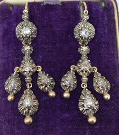 A lovely pair of Early Victorian Pendant Earrings. These earrings are of French Origin dating from 1838-1846. They are crafted from 18K yellow gold & sterling silver. The tops can be worn alone and look amazing as petite earrings or they can be worn as day and night earrings. I love the versatility and look of these earrings in both ways. The top portion features a single tiny silver ball in a raised collet setting. The portion also features a loop where the back to front closure hooks into. Jus Victorian Style Hallmarked Earrings For Formal Occasions, Formal Victorian Hallmarked Earrings, Victorian Hallmarked Dangle Earrings, Victorian Dangle Earrings Hallmarked, Victorian Style Hallmarked Dangle Earrings, Victorian Hallmarked Drop Earrings, Antique Hallmarked Earrings For Anniversary, Antique White Gold Earrings With 17 Jewels, Antique Hallmarked Dangle Earrings