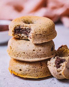 a stack of doughnuts sitting next to each other on top of a table