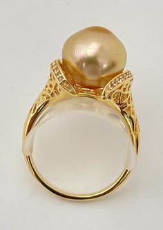 Luxury Gold Topaz Ring, Luxury Gold Pearl Ring With High Luster, Luxury High Luster Gold Pearl Ring, Luxury Gold Topaz Ring For Anniversary, Fine Jewelry Gold Pearl Ring With Gemstone, Gold Rings With High Luster, Luxury Gold Pearl Ring, Exquisite Gold Topaz Ring, Elegant Gold Hallmarked Topaz Ring