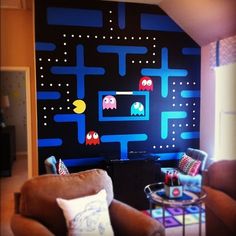 the living room is decorated in retro video games