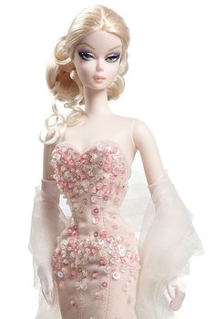 a barbie doll wearing a pink dress with flowers on it's chest and arms