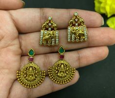 Gorgeous antique gold plated kempu CZ stone lakshmi and beautiful elephant studs earrings. Statement South Indian Style stud Earrings. These beautiful earrings come with kempu, white and green CZ stones, studded pearl. A gorgeous choice for any simple traditional outfit. Item size: Design 1: 2.9 cm length and 2 cm width approximately  Design 2: 2.1 cm length and 1.4 cm width approximately Closure: Pushback Ready to ship from FL USA Care: We don't want your special moments to fade. To maintain the quality of your jewelry, please => It is recommended to keep all your jewelry in Air-tight Bags to keep them intact for years to come. => Do not wear it to the pool, spa, or the beach. => Remove when sleeping, exercising, or doing other physically strenuous activities. Help: => We can add a gift c Coral Studs In Gold Indian, Gold Meenakari Temple Earrings, Traditional Gold Multi-stone Earrings, Laxmi Devi Earrings Gold Studs, Lakshmi Earrings Gold Studs, Temple India, Beautiful Elephant, Elephant Earrings Studs, Mom Earrings