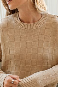 The Willow Sweater boasts a subtle checkered texture knit, providing a unique touch to this cozy and cute piece. Crafted with super soft fabric, it will keep you warm and stylish all season long. Its the perfect layer for any occasion! FINAL SALE- No returns or exchanges FIT Easy True To Size Fit Soft + Plush Subtle Checkered Pattern Stretchy + Lightweight Natalia 5'9 Wearing Size Small SMALL MEDIUM LARGE 19.5" Long 20" Long 20.5" Long 23.5" Wide 24" Wide 24.5" Wide For more sizing information, Early Winter, Small Sweater, Textured Knit, Checkered Pattern, Winter Collection, Soft Plush, Soft Fabrics, Knitting, Fabric