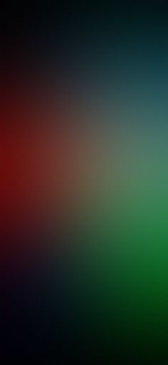 a blurry image of an orange, green and red background