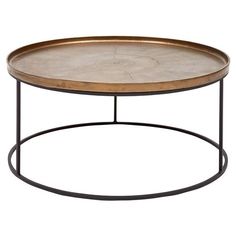 an oval metal and wood coffee table