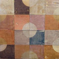 an abstract painting with different colors and shapes on the side of a brick wall that has circles painted on it