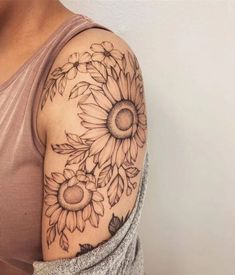 a sunflower tattoo on the left arm and shoulder is shown in this instagramtion