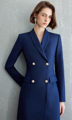 Exude Confidence with the Navy Double-Breasted Blazer Dress Step into a world of refined elegance with our Navy Double-Breasted Blazer Dress—the epitome of power dressing for the modern woman. This dress combines the sharp tailoring of a blazer with the femininity of a dress, creating a look that is both authoritative and elegant. Crafted from high-quality fabric, it features a sleek navy hue, structured shoulders, and gold-tone buttons that add a touch of luxury. The long sleeves and tailored f Elegant V-neck Blazer For Semi-formal Occasions, Elegant V-neck Semi-formal Blazer, Elegant Double-breasted Blazer For Work, Elegant Formal Suit With Double Button Closure, Elegant Tailored Blazer Dress With Lapel Collar, Elegant Double-breasted Formal Suits, Elegant Single Breasted Structured Suits, Elegant Structured Double-breasted Blazer, Elegant Single-breasted Structured Suits