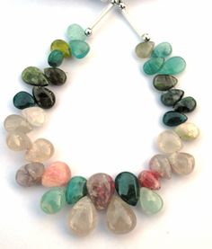 a necklace with many different colored stones on it