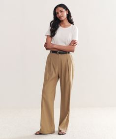 Riley Trouser Safari The perfect summer-ready trouser that features a lightweight feel. Meant to be worn with a relaxed fit for a breezy and effortless look. 50% linen, 47% viscose, 3% spandex. Made in Turkey. Features box pleat in the front. | Jenni Kayne Women's Riley Trouser Size 14 Versatile High-waisted Viscose Pants, Relaxed Fit Ankle-length Wide Leg Pants For Business Casual, Relaxed Fit Viscose Bottoms, Versatile Relaxed Fit Viscose Bottoms, Relaxed Fit Viscose Wide-leg Pants, Chic Linen Bottoms For Business Casual, Spring Workwear Wide Leg Viscose Pants, Wide Leg Viscose Pants For Daywear, Spring Workwear Viscose Wide Leg Pants