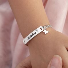 Personalized this adorable baby bracelet with your kid's name on the bar and a cute charm of your choice, making a great gift idea for special occasions such as the first birthday, baptism and many more!  ► PERSONALIZED KID NAME BRACELET WITH CHARM * Pendant measures approx: 1 17/64 x 1/4 inch * By default, silver items comes with BLACK engraving and gold-plated item comes with CLEAR engraving. * Age group bracelet size recommendation: Newborn to 6 months - XXS: bracelet's circumference (includes opening) is 4" +  1" extender 6 to 12 months - XS: bracelet's circumference (includes opening) is 4.5" + 1" extender 1 to 4 years - S: bracelet's circumference (includes opening) is 5" + 1" extender 4 to 7 years - M: bracelet's circumference (includes opening) is 5.5" + 1" extender 7 to 12 years - Cute Silver Name Bracelet For Gift, Cute Personalized Charm Bracelet With Custom Name, Cute Silver Name Bracelet Gift, Silver Name Bracelet Cute Gift, Cute Personalized Name Charm Bracelet, Cute Silver Name Bracelet, Silver Adjustable Nameplate Charm Bracelet, Cute Personalized Name Bracelet As Gift, Cute Personalized Name Bracelet For Gift