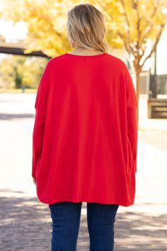 top, shirt, tunic, red, holiday, christmas, long sleeve, pockets Oversized Solid Color Casual Tunic, Oversized Solid Casual Tunic, Oversized Red Top For Layering, Oversized Red Solid Color Tops, Casual Red Long Sleeve Tunic, Oversized Solid Red Tops, Red Winter Tops, Red Solid Color Winter Tops, Oversized Red Top