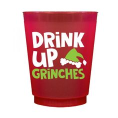 a red plastic cup with the words drink up grinches on it's side