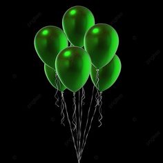 a bunch of green balloons are floating in the air on a black background with some streamers