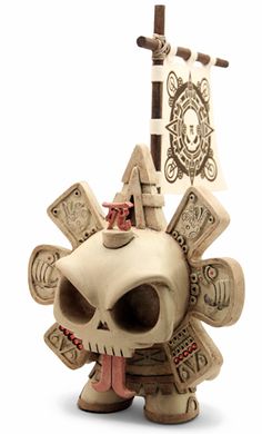 a skull figurine with a pirate flag on it's head and chest