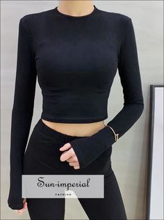 Sun-Imperial - Women Slim Long Sleeve Fit Crop Tee – SUN-IMPERIAL Stretch V-neck Tops With Thumbholes, Fitted Long Sleeve Elastane T-shirt, Basic Cropped Elastane Tops, Basic Stretch Tops In Solid Color, Basic Stretch Solid Color Tops, Basic Solid Color Stretch Tops, Stretch Solid Color Elastane Tops, Black Tops With Thumbholes For Spring, Black Spring Top With Thumbholes