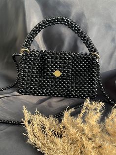 I carefully make my stylish looking pearl bags that you can easily use on your special days. ♡color black ♡%100 handmade  ♡the threads are unbreakable  ♡ıt has a long ♡We do not have a return option ♡produced in desired dimensions ♡ıf you have an questions, do not hesitate to ask questions. I am always happy to help those who visit my page and improve my products. Elegant Black Beaded Bags, Black Beaded Rectangular Clutch, Black Top Handle Bag With Pearl Handle, Elegant Handmade Black Bag, Elegant Black Beaded Rectangular Evening Bag, Elegant Rectangular Black Beaded Evening Bag, Black Handheld Bags With Pearl Handle, Black Handheld Bag With Pearl Handle, Black Rectangular Bag With Pearl Handle