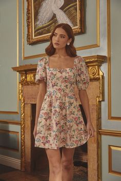 Bring the Marley Floral Eyelet Mini Dress, to your garden party or for any sunny day! An adorable floral print shapes trendy puff sleeves with elastic at the cuffs, a square neckline, and a seamed bodice. The back includes a tie knot and a small open back detail which makes it extra cute! - Puffed short sleeves- Square neckline- Smocked- Tie back- Color: Pink Green MultiSize + Fit - Model is 5'8" and wearing size XS- Measurements taken from size S - Chest: 15 1/2"- Length: 46" Fabric Self:100% C Holiday Weekend, Pink Mini Dresses, Tie Knots, Square Necklines, Sunny Day, Square Neckline, Garden Party, Puff Sleeves, Pink And Green