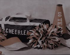 an oil painting of cheerleader gear including a bag and pom - poms