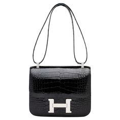 The Hermés bag embodies the quintessence of style and luxury due to its impeccable design, craftsmanship, and significance. That being said, it is the most iconic and desired piece from the Hermés handbag collection. Hermes Crossbody Bag, Black Alligator, Handbag Collection, Future Outfit, Hermes Constance, Hermes Handbags, Hermes Bag, High Jewelry, Kate Spade Crossbody