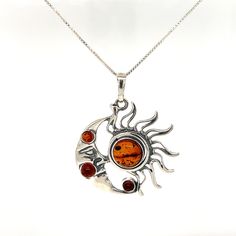 A beautiful Magical Sun and Moon Amber Pendant featuring celestial bodies - the sun and moon by Super Silver. Amber Pendant, Amber Stone, Sun And Moon, The Divine, Baltic Amber, Cognac, Amber, Celestial Bodies, 925 Sterling Silver