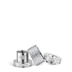 two silver rings with white diamonds on top and one is in the shape of a rectangle