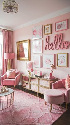 a living room with pink furniture and pictures on the wall