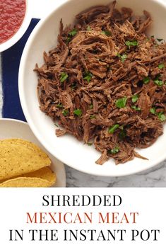 shredded mexican meat in the instant pot with salsa and tortilla chips on the side