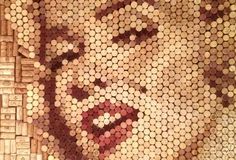 marilyn monroe made out of bottle caps is shown in this mosaic art work on the wall