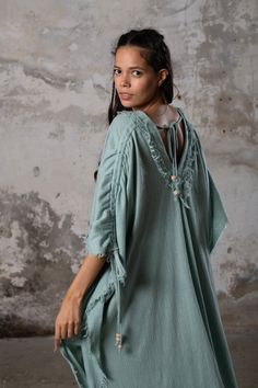 PUSKUL Kaftan embodies the essence of boho-chic, a natural and ethereal dress that effortlessly combines comfort and style. Crafted from the softest cotton available, this dress will envelop your skin like a gentle, warm embrace. PUSKUL Kaftan is versatile and can be worn on any occasion, from the dance floors to formal events, street wear to desert outfits. You can also wear it in two distinct styles: as a kaftan or as a sultry dress, simply by changing the way you put it on! Puskul Kaftan is e Chic Cotton Maxi Dress For Beach Cover-up, Spring Maxi Dress With Natural Dye, Flowy Festival Dress With Natural Dye, Spring Maxi Length Dress With Natural Dye, Bohemian Tunic For Daywear With Relaxed Fit, Bohemian Tunic With Relaxed Fit For Daywear, Bohemian V-neck Dress With Natural Dye, Bohemian Flowy Beach Dress For Daywear, Chic Tunic Maxi Dress For Loungewear