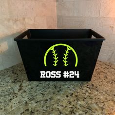 a black box with the word ross 24 on it sitting on a marble counter top