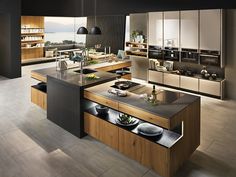 a large kitchen with an island in the middle and lots of counter space on each side