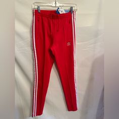 Adidas Adicolor Sst Track Pants Size Xs Color Vivid Red Slim Fit Drawcord On Elastic Waist 50% Cotton, 43% Recycled Polyester, 7% Elastane Doubleknit Mid Rise Zip Pockets Adidas Adicolor, Adidas Women, Track Pants, Adidas Originals, Red Color, Pant Jumpsuit, Zip Pockets, Mid Rise, Elastic Waist