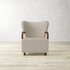 a white chair sitting on top of a hard wood floor