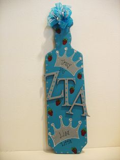 a blue tag with a crown and name on it