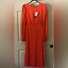 Jealous Tomato Coral (Looks More Orange In Picture). Medium, Nwt, Never Worn. Small Side Cut Outs. Orange Pleated Midi Dress For Spring, Spring Orange Pleated Maxi Dress, Pleated Orange Maxi Dress For Spring, Fitted Orange Pleated Midi Dress, Fitted Orange Pleated Dress, Side Cuts, Medium Long, Cut Outs, Color Orange