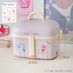 a pink suitcase with cartoon drawings on it