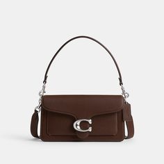 A modern take on an archival 1970s Coach design our structured Tabby shoulder bag is crafted of polished pebble leather. Finished with our Signature hardware for an iconic touch the compact 26 features two detachable straps to carry by hand style as a short shoulder bag or wear crossbody. | Coach Tabby Shoulder Bag 26 - Women's - Silver/maple Coach Tabby Shoulder Bag, Coach Tabby 26, Tabby Shoulder Bag, Coach Tabby, Hand Style, Structured Design, Polished Pebble, Signature Hardware, Pretty Bags