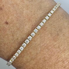 Beautiful diamond bracelet gold.  Excellent craftsmanship, the diamonds are nice and super sparkling.  The setting really shows off the diamonds beautifully.  About 2.1mm  width.  Wear this simple and beautiful bracelet by it self or stack with other bracelets.  Lays perfectly on the wrists, won't flip over.  There's two safety clasp for a secure fit.  This bracelet is perfect for everyday wear, it's not too big and not small. 7" in length.  Good quality diamonds, no black carbon spot when viewed under a magnifying glass.   Genuine Earth Mined Round Brilliant Cut Diamonds Natural  Total weight: 2.29 Carats Clarity: SI1 Color: F All shiny and white diamonds, no cloudy or yellowish stones  Solid 18K Yellow Gold 6.39 grams Comes with gift box AT10400 Yellow Gold Diamond Bracelets With Prong Setting, Dazzling Gold Diamond Bracelet For Anniversary, Fine Jewelry Gold Diamond Bracelet Vvs Clarity, Yellow Gold Diamond Bracelet With Diamond Cut, Luxury Gold Bracelet With Prong Setting In White Gold, Yellow Gold Diamond Tennis Bracelet With Vvs Clarity, Diamond White Brilliant Cut Gold Bracelet For Anniversary, Diamond White Gold Bracelet With Brilliant Cut For Anniversary, Fine Jewelry Diamond White Gold Bracelet