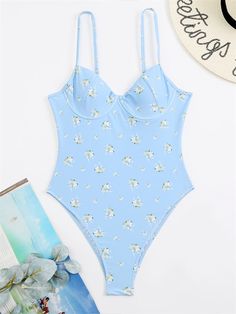 This Absolute Sweetheart Bustier Swimsuit will make you feel gorgeous and confident as you flaunt your style in the sun. Featuring beautiful floral detailing, this swimsuit is sure to turn heads. Poolside Swimwear With Sweetheart Neckline And Built-in Bra, Spring Tankini With Built-in Bra And Underwire, Blue Swimwear With Built-in Bra For Summer, Summer Poolside Bodysuit With Built-in Bra, Trendy Swimwear With Built-in Bra For Spring, Summer Underwire Swimwear With Adjustable Straps, Spring Tankini For Pool With Lined Body, Spring Underwire Tankini With Built-in Bra, Spring Swimwear With Adjustable Straps And Underwire